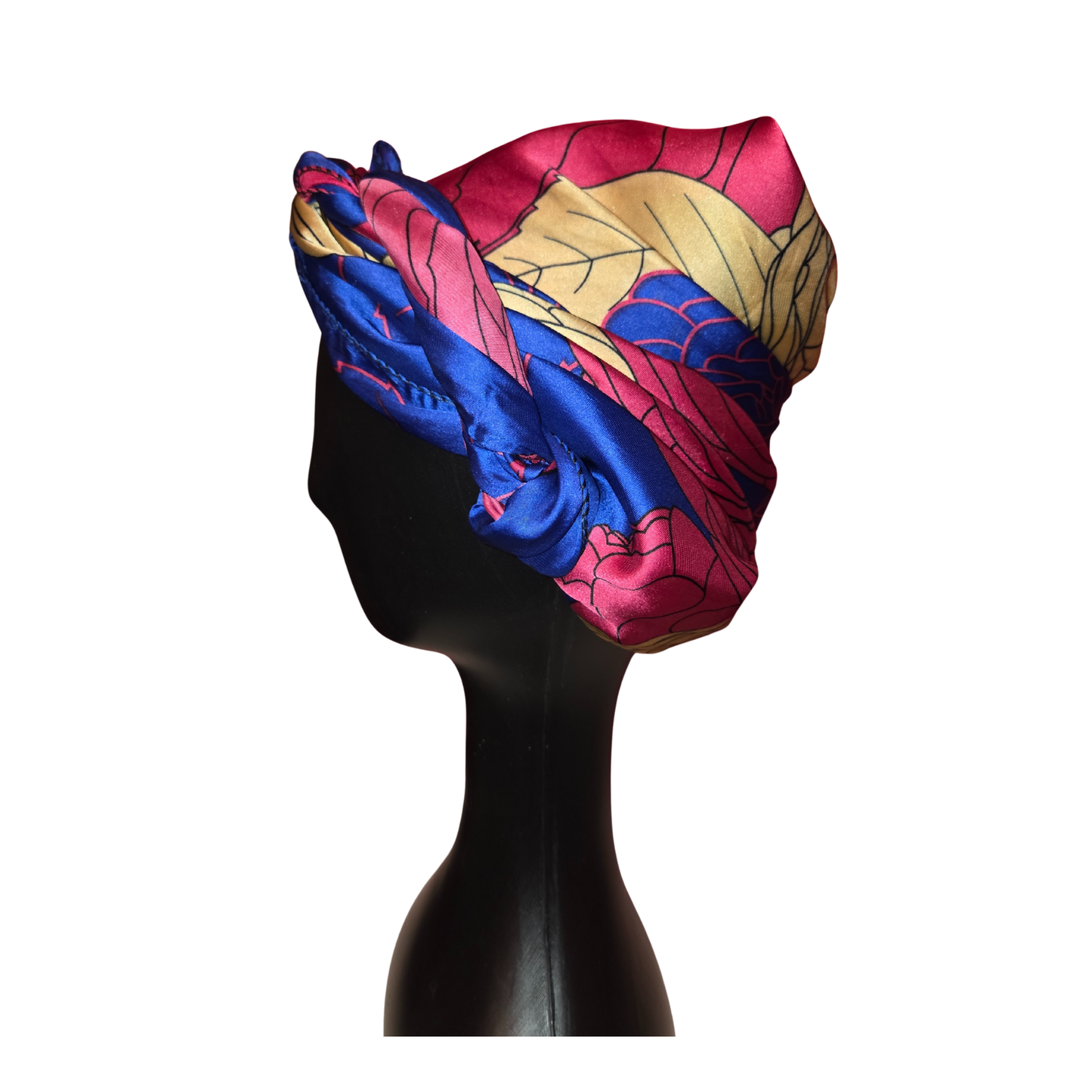 Colorful headscarf on a mannequin head against a white background