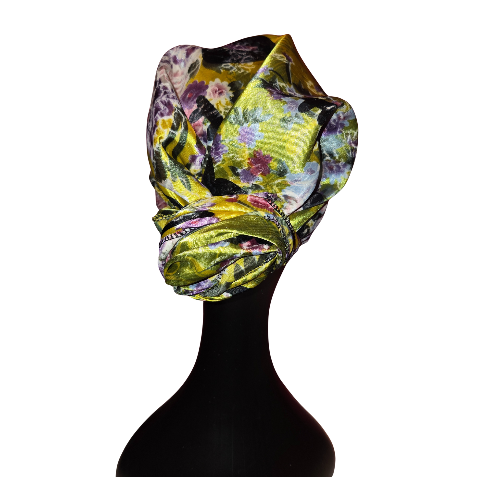 Floral patterned headscarf on a black mannequin head against a white background