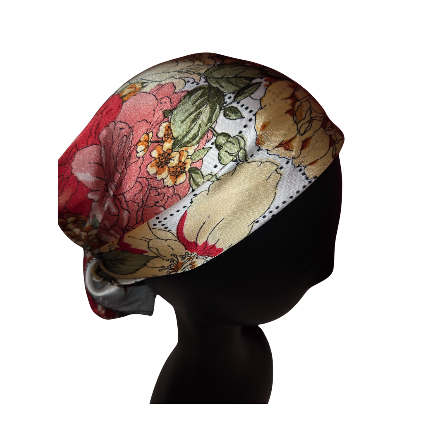 Floral patterned headscarf on a mannequin head against a white background