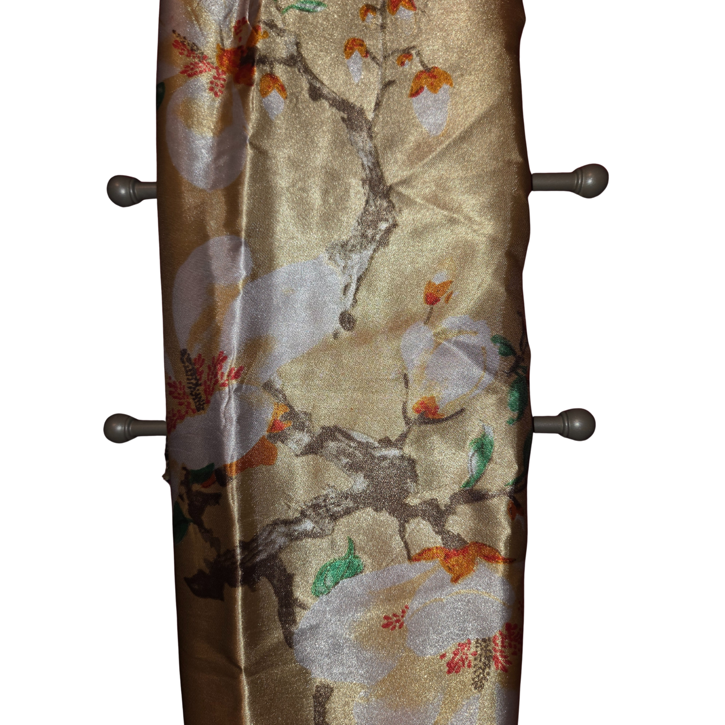 Decorative wall hook with floral pattern on a beige background