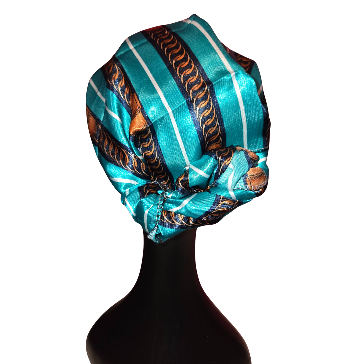 Turban with blue and brown pattern on a mannequin head against a white background
