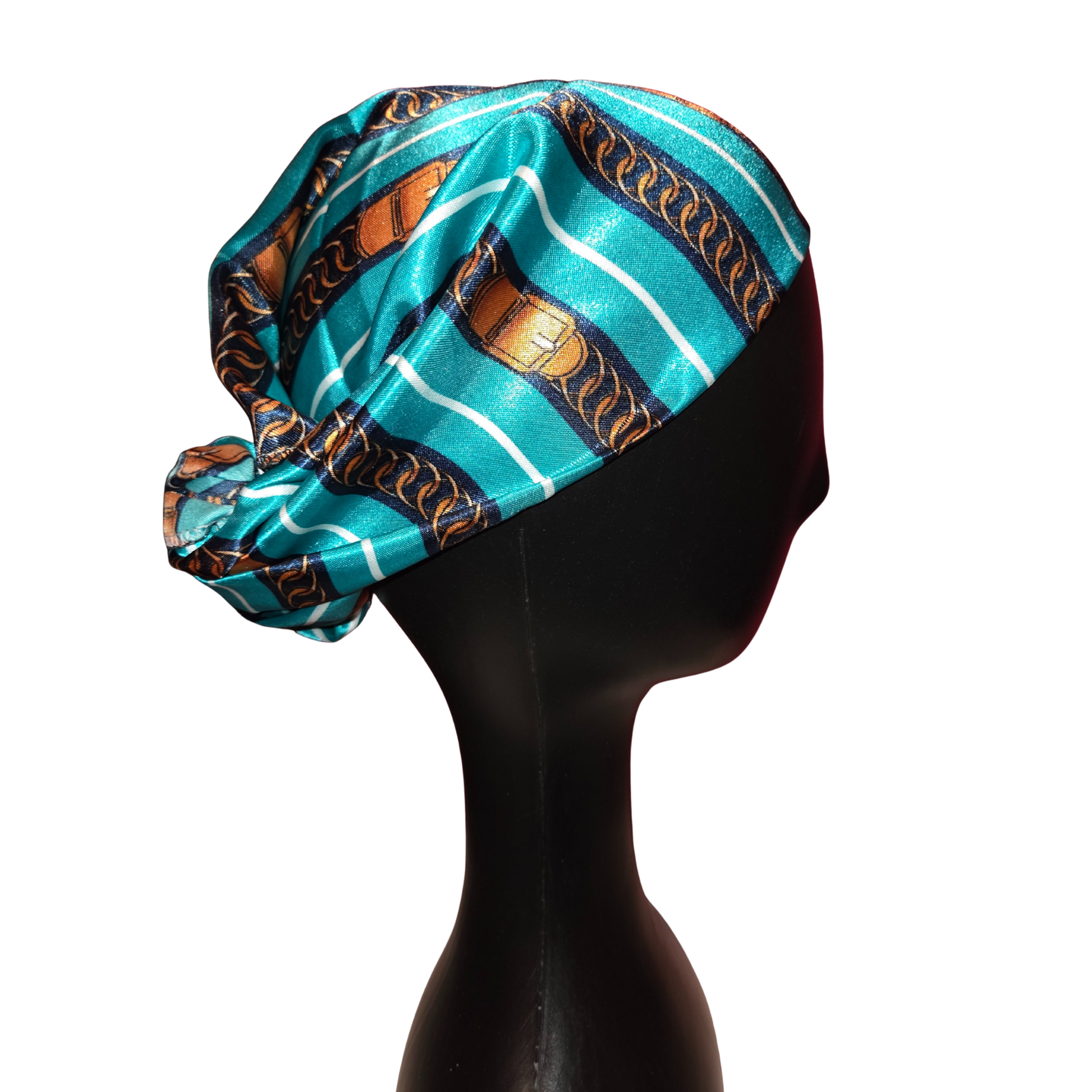 Turquoise satin headscarf with gold patterns on a black mannequin head.
