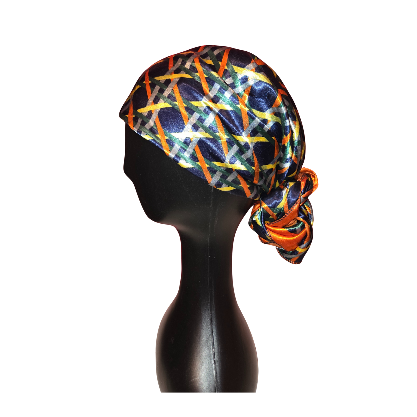 Colorful headscarf on a mannequin head against a white background