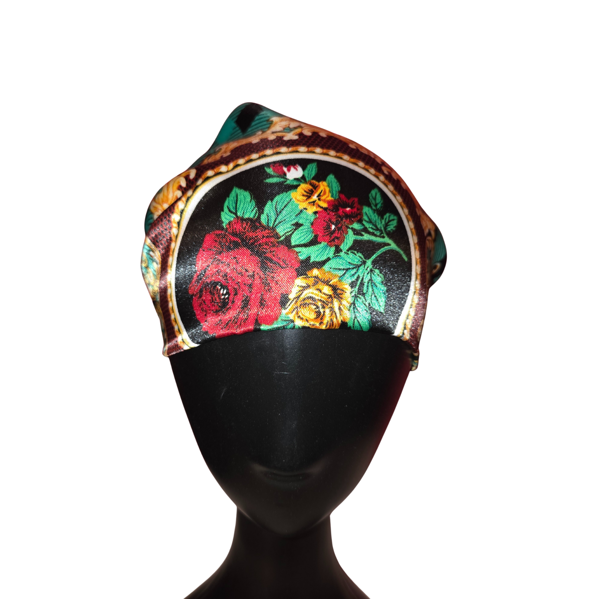 Colorful floral headband on a black mannequin head against a white background