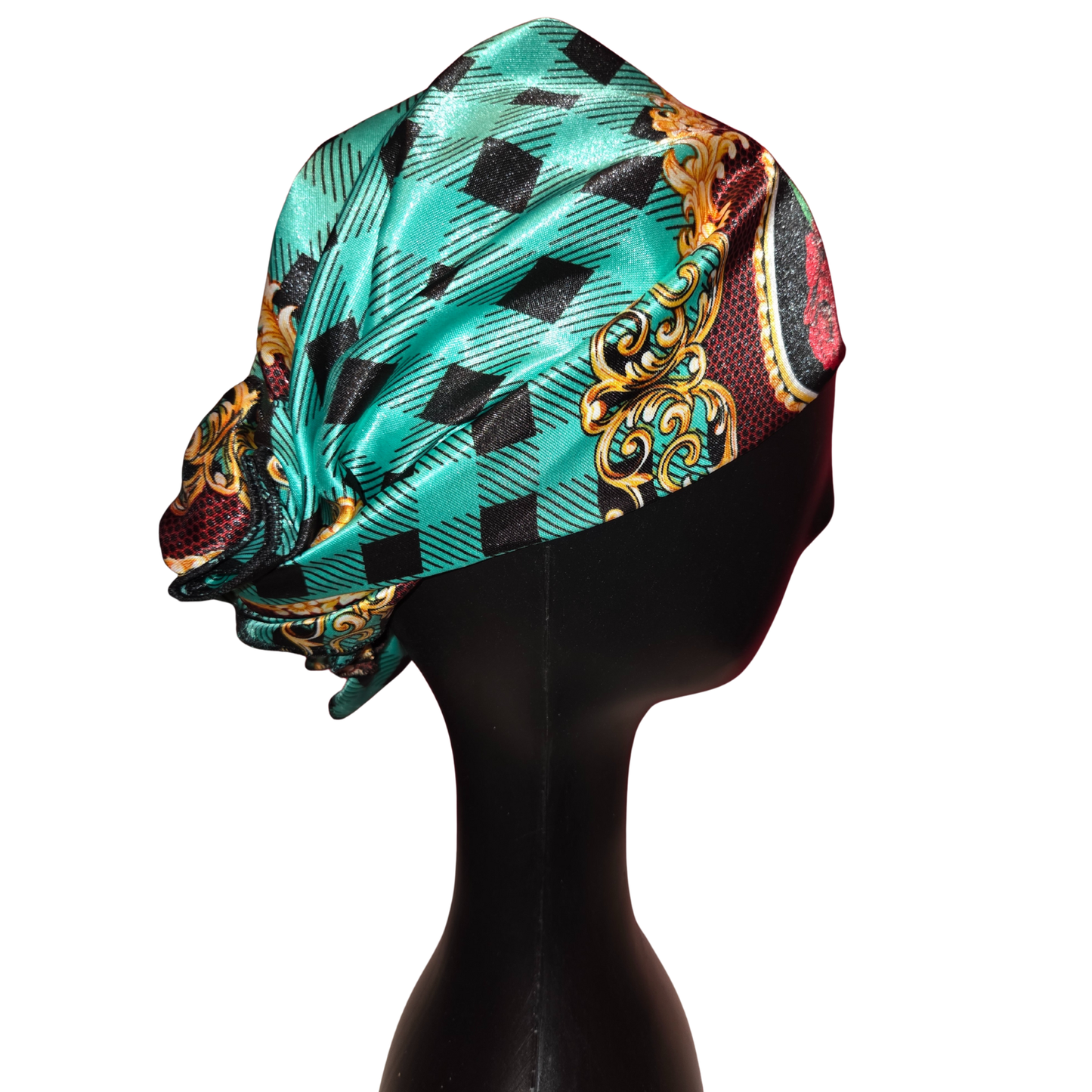 Colorful patterned headscarf on a mannequin head against a white background
