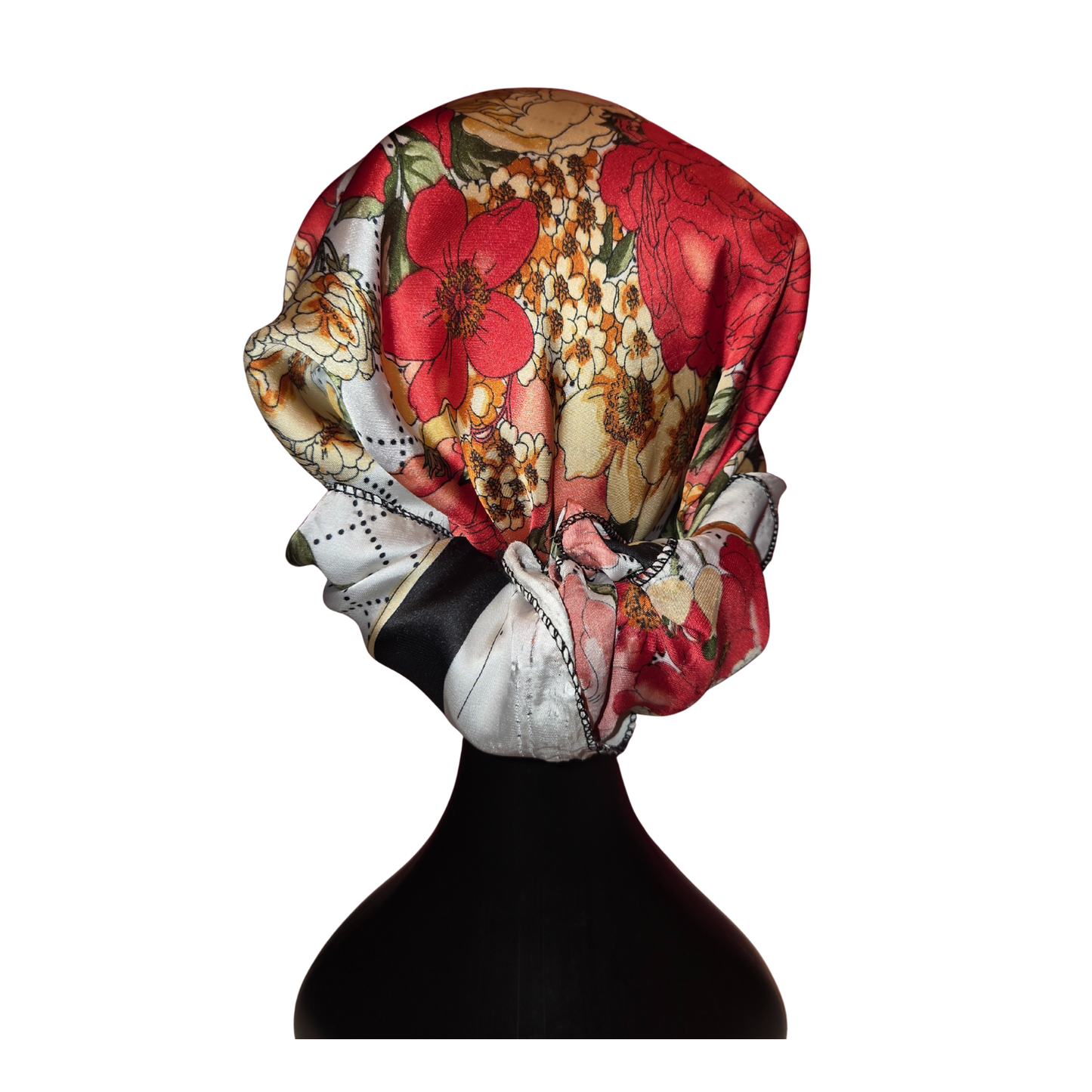 Floral headscarf on a mannequin head against a white background