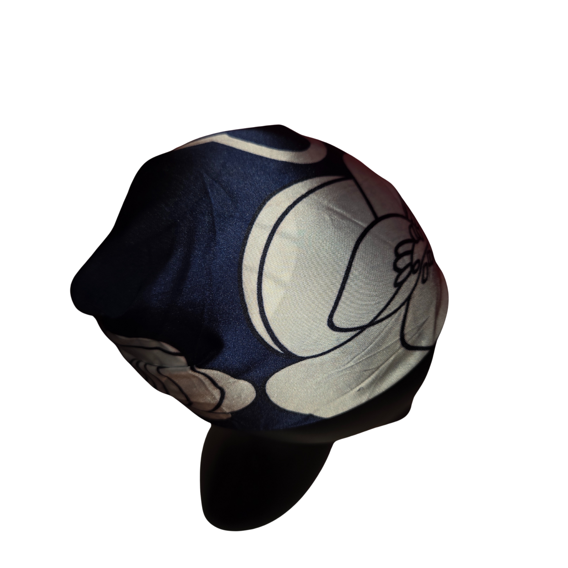 Black cap with white floral design on a white background