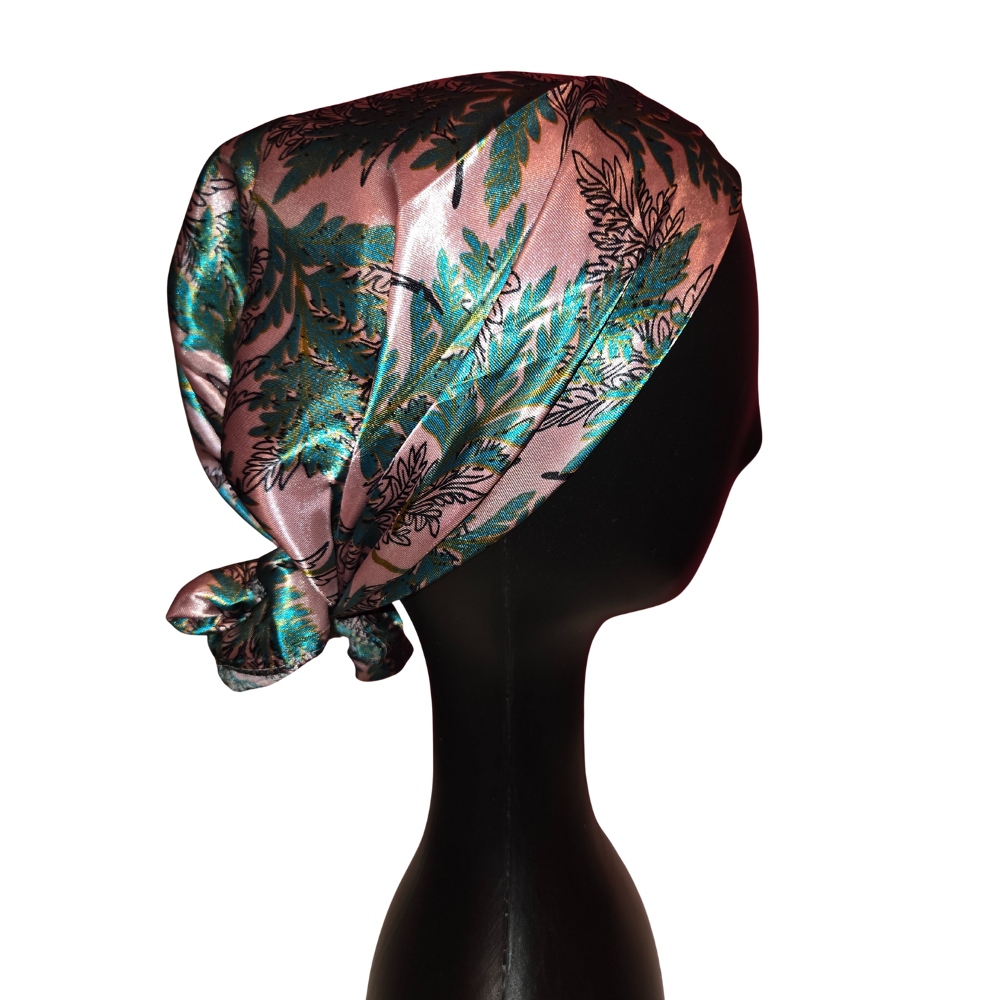 Silky headscarf with floral pattern on a mannequin head against a white background