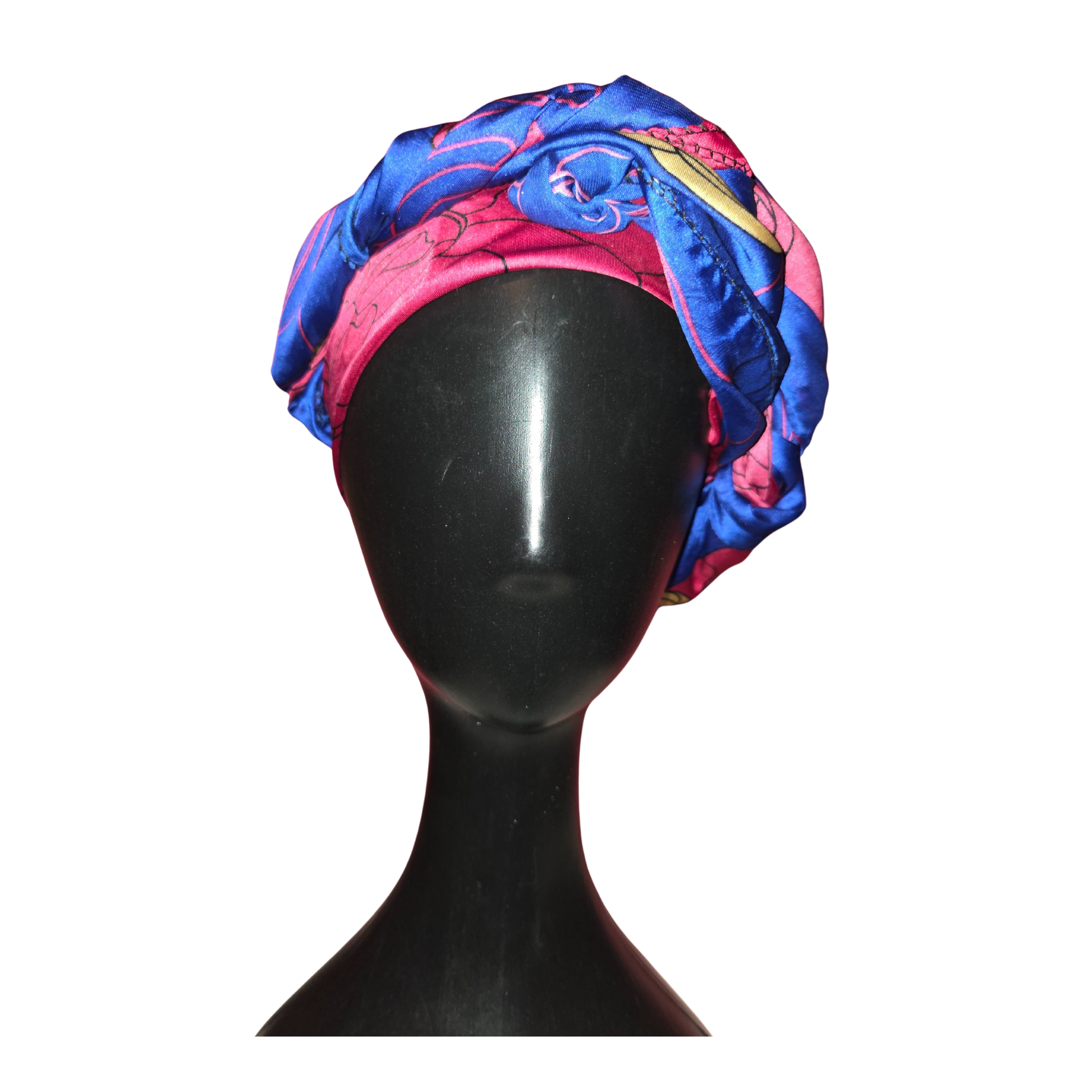 Colorful headscarf on a black mannequin head against a white background