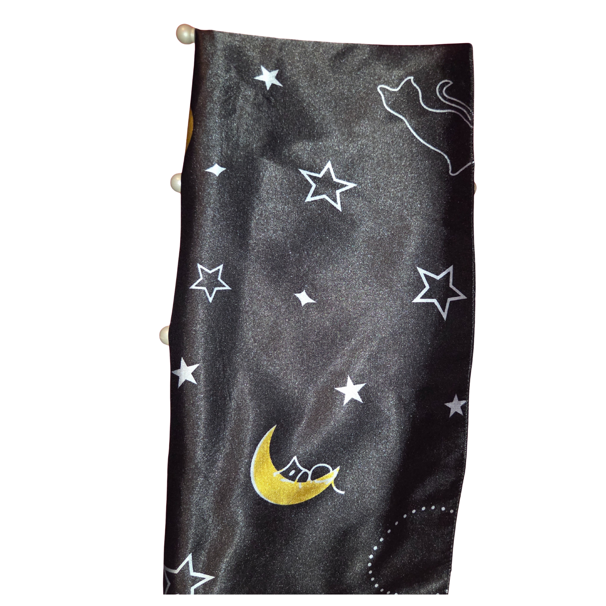 Black fabric with white star patterns and a yellow moon on a white background