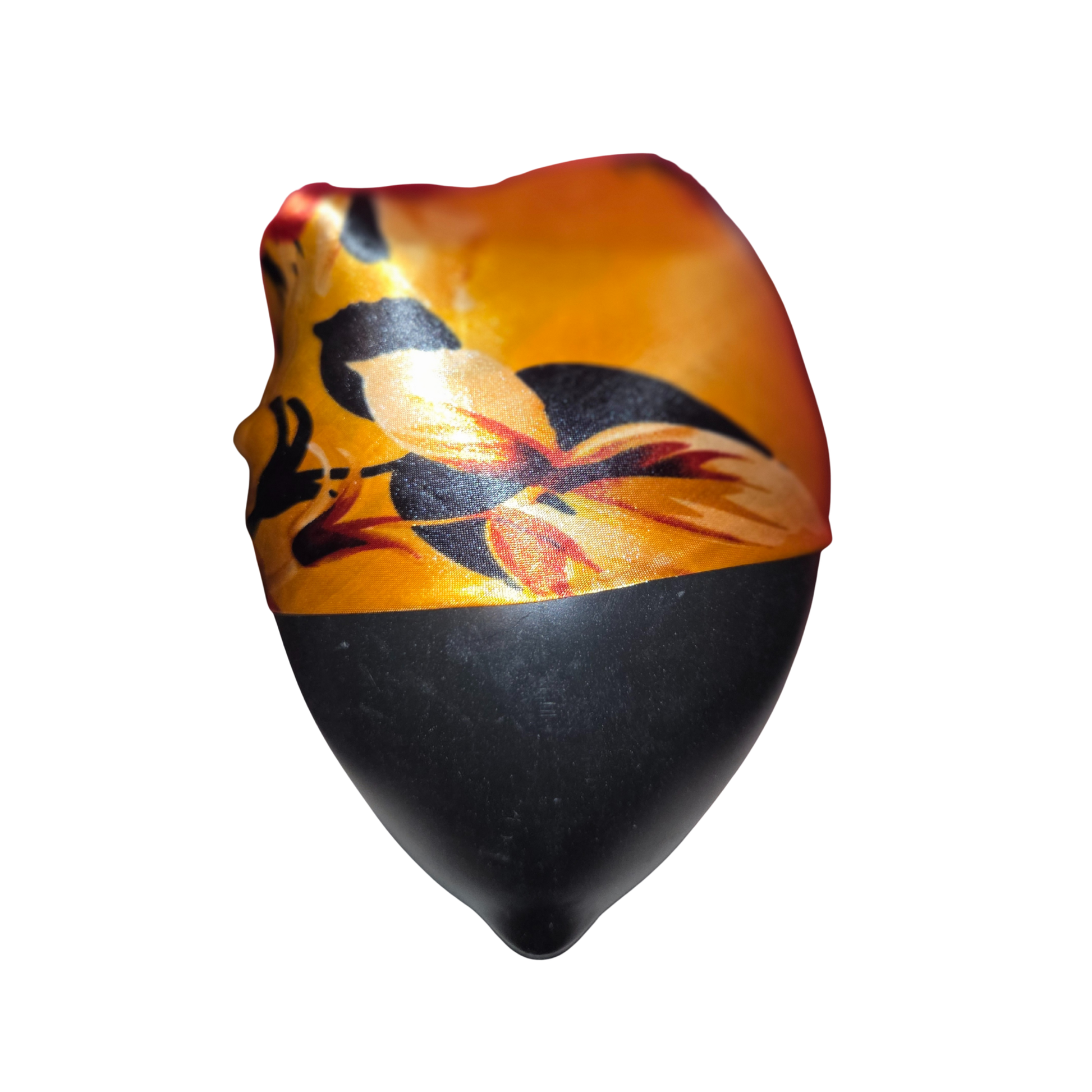 Decorative object with black and orange design on a white background
