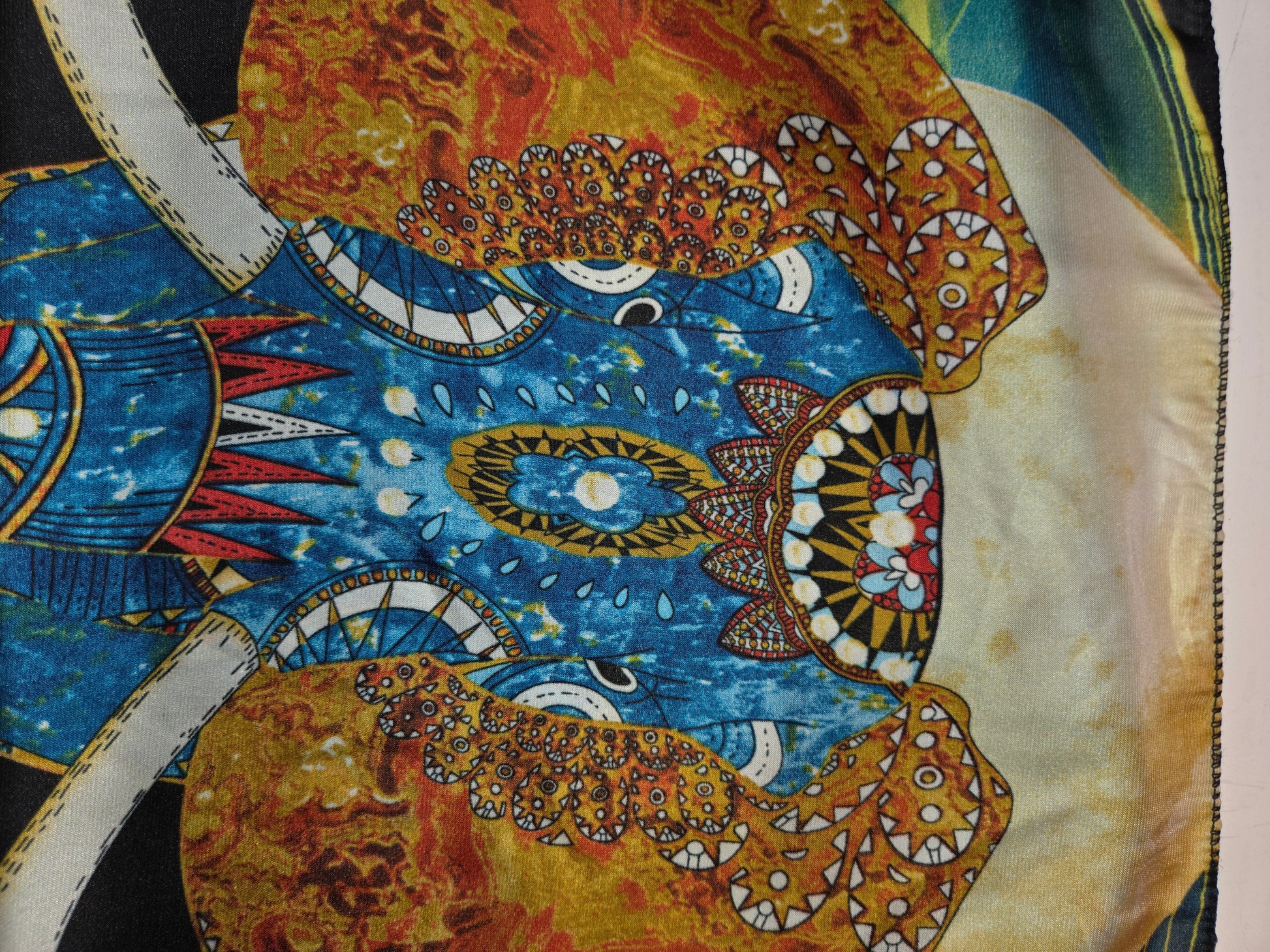 Decorative Scarf with intricate patterns and colors on a beige background