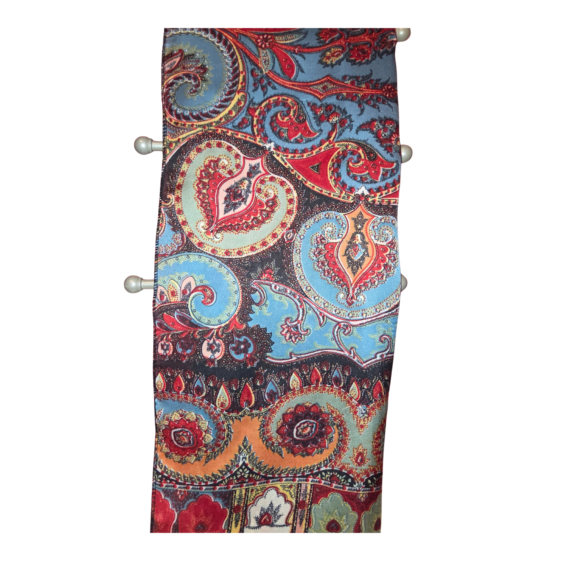 Colorful paisley patterned fabric roll on a white background