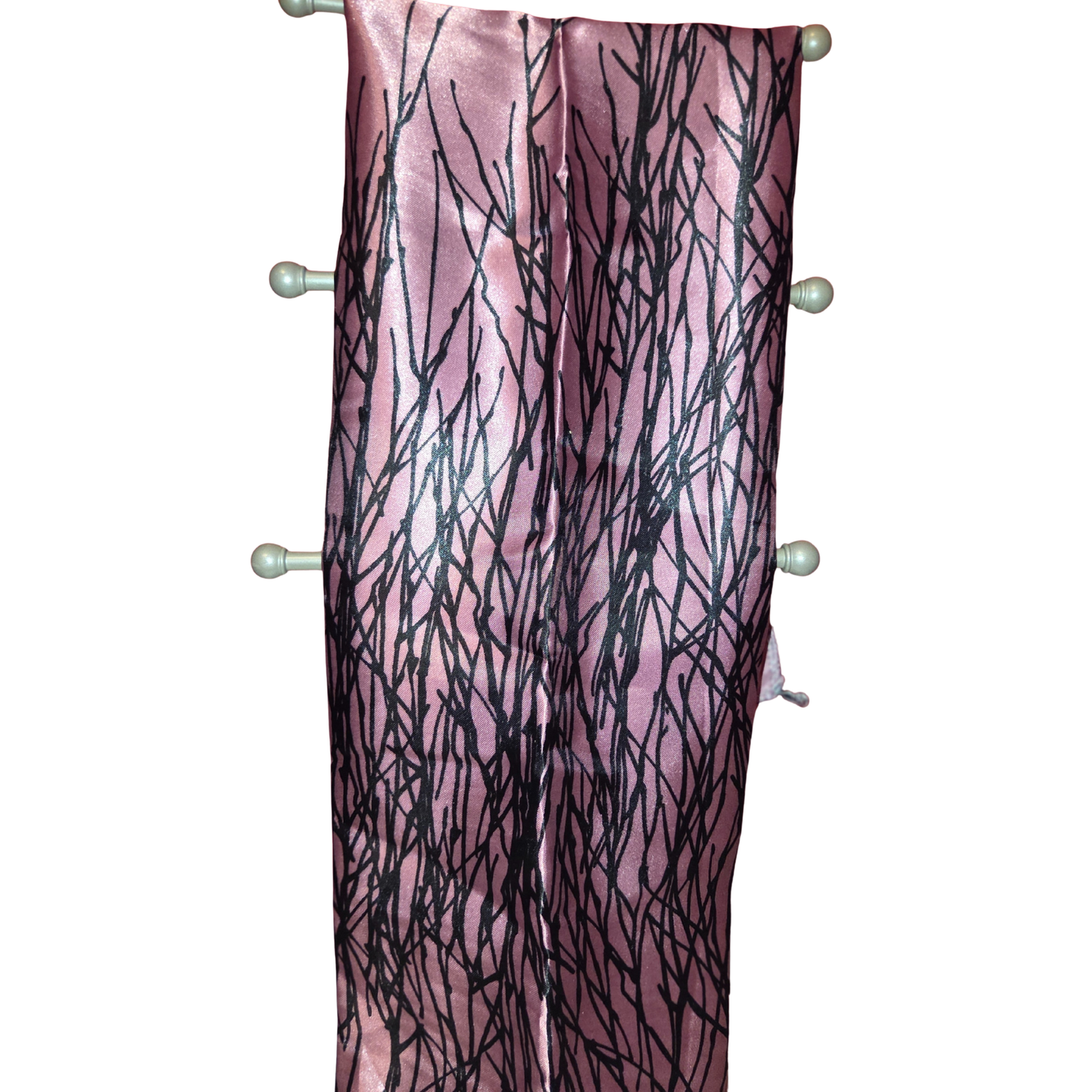 Pink scarf with black abstract pattern on a white background
