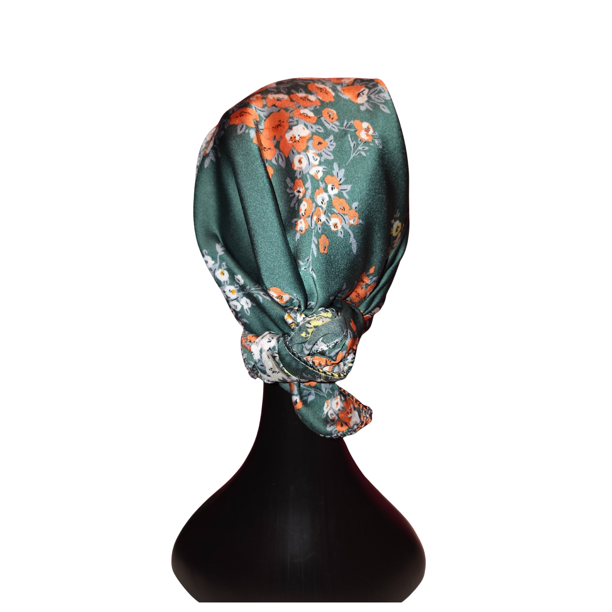 Floral headscarf on a black mannequin head against a white background