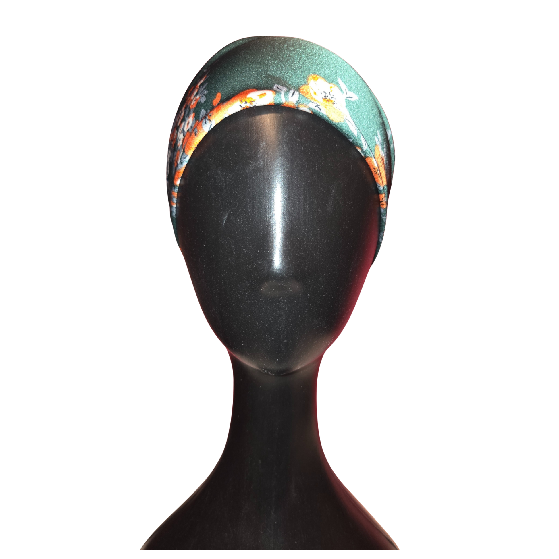 Colorful headband on a black mannequin head against a white background