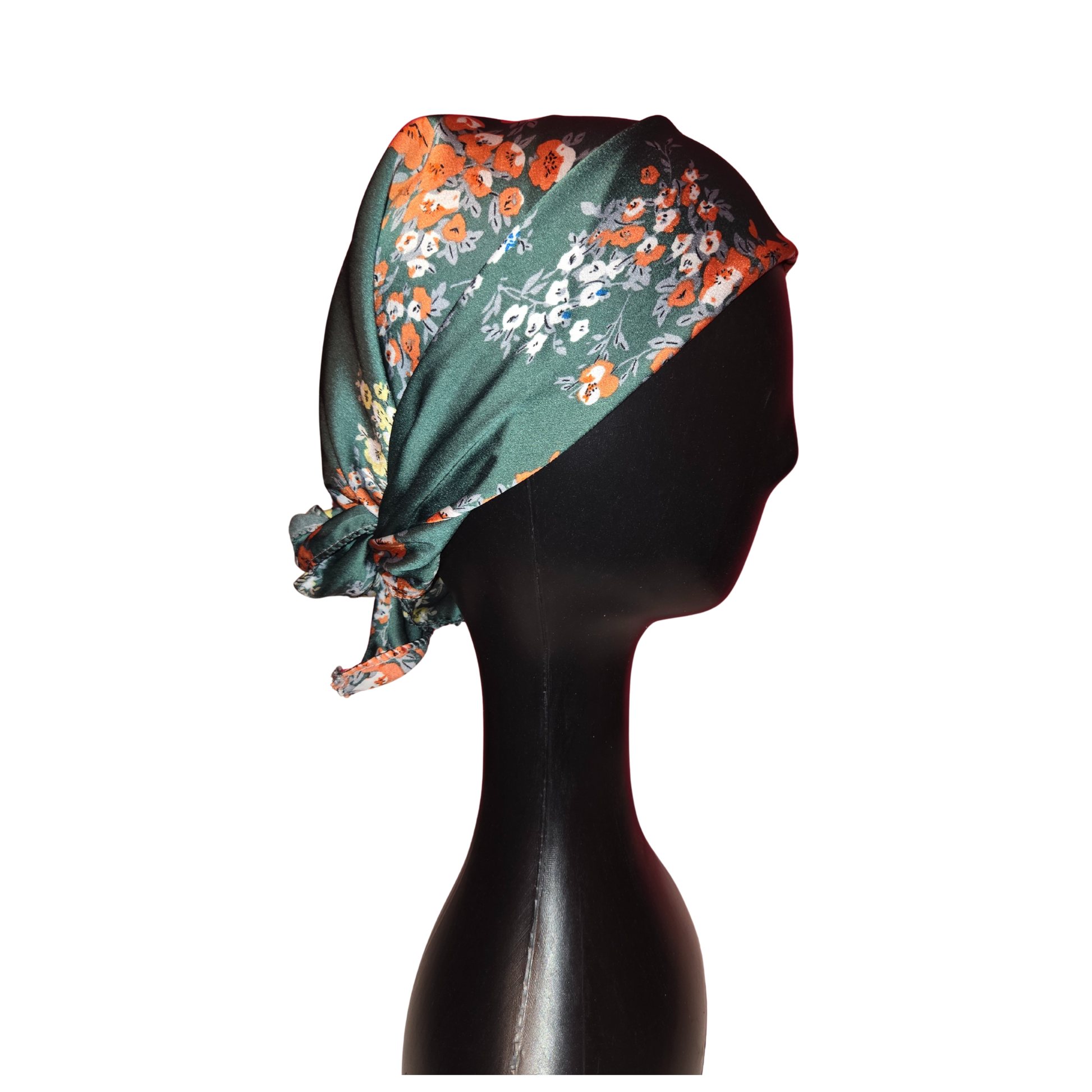Floral headscarf on a mannequin head against a white background