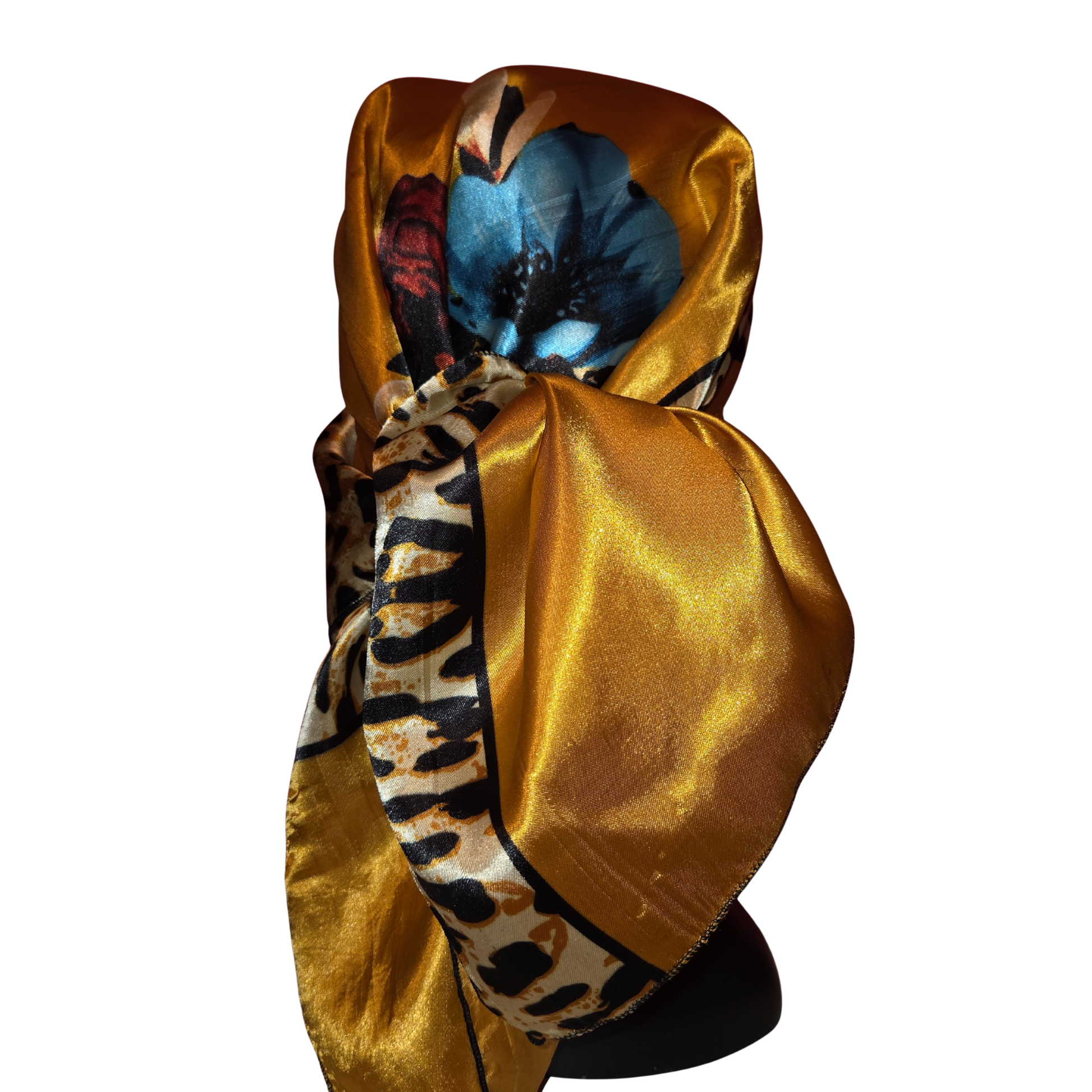 Gold satin headscarf with animal print patterns on a white background